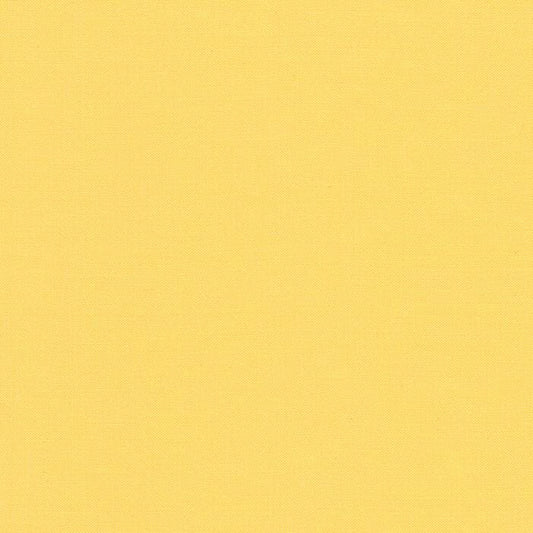 Buttercup  Kona Cotton Solid - K001-1056 by Robert Kaufman - Sold in 1/2 yard increments, continuously cut